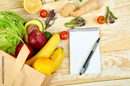 Fotografija Shopping list, recipe book, diet plan. Grocering concept.