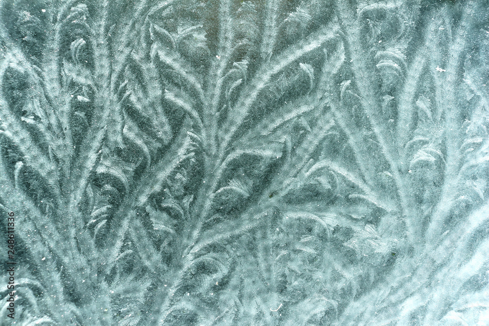 Natural pattern formed by frost on an outside glass table top Natural pattern formed by frost on an outside glass table top