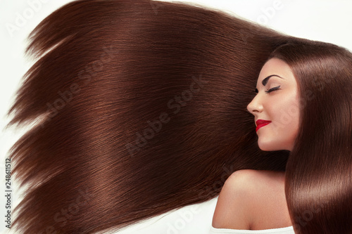 Beautiful Hair. Beauty woman with luxurious long hair as background. Beauty Model Girl with Healthy brown Hair. Pretty female with long smooth shiny straight hair. Hairstyle. Keratin straightening.