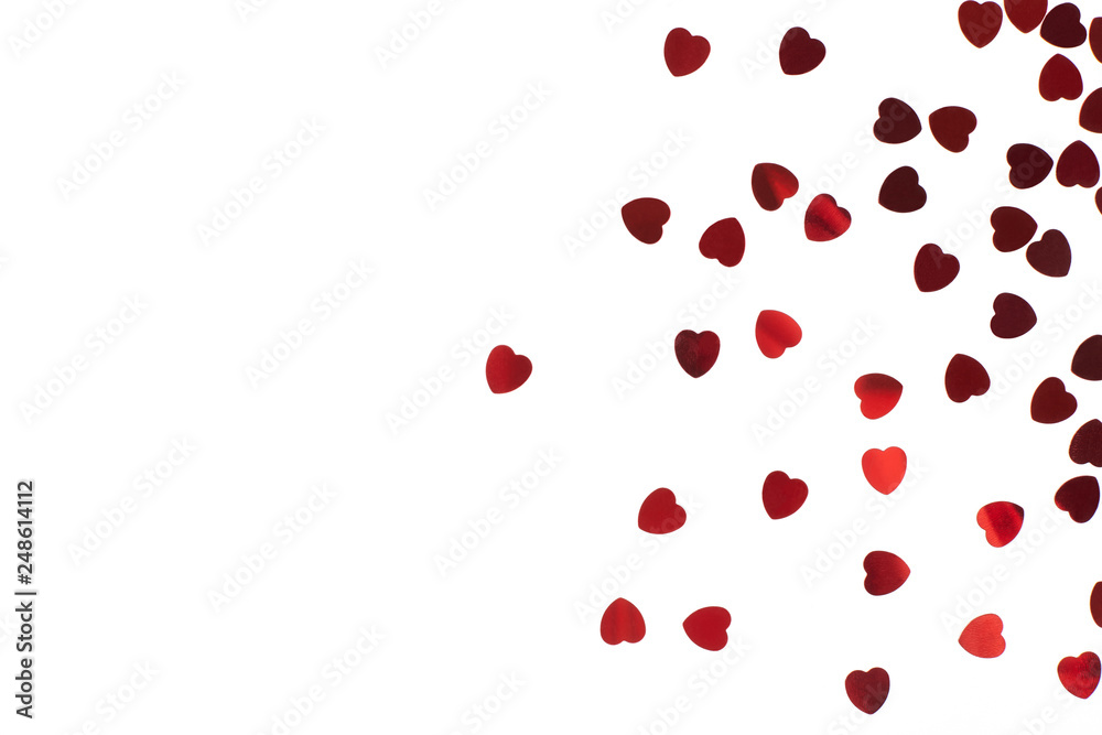 Red hearts confetti on white background. Valentine's day