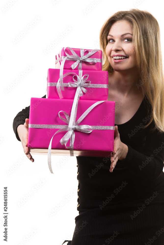 Girl holding stack of pink gift boxes Girl holding stack of pink gift boxes