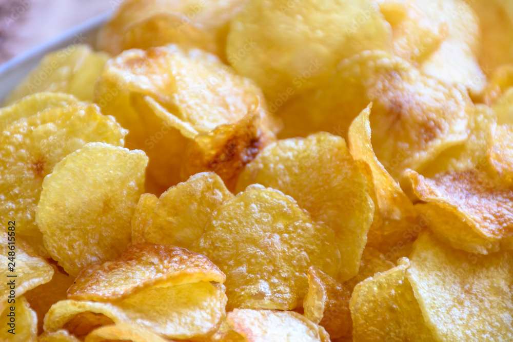 Closeup of plate with several chips potatoes ready to be served Closeup of plate with several chips potatoes ready to be served