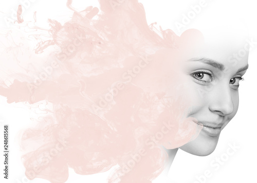 Double exposure of woman face and smoke