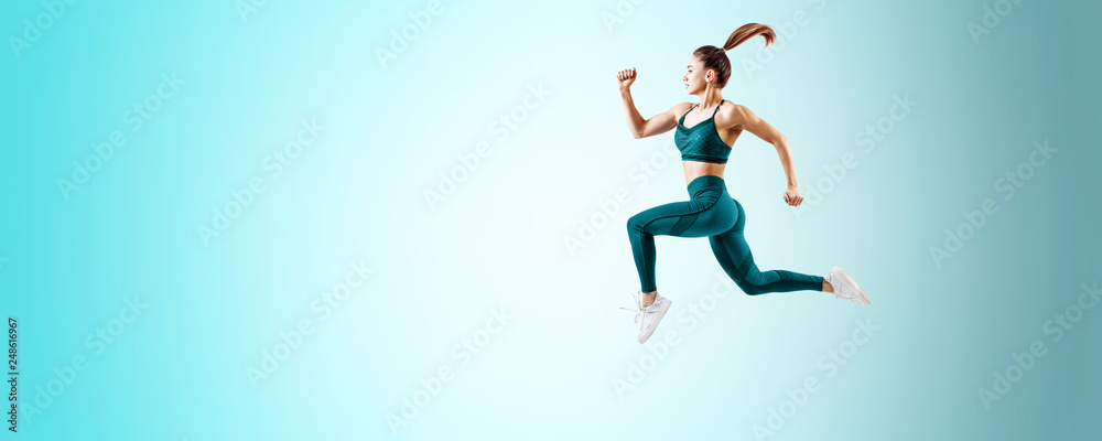 Young woman runner in blue sportswear jump in the air. - obrazy, fototapety, plakaty 