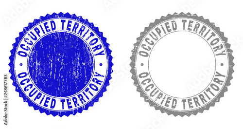 Grunge OCCUPIED TERRITORY stamp seals isolated on a white background. Rosette seals with distress texture in blue and gray colors.