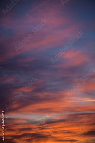  Sunset sky with clouds. Golden sunlight for your idea of web header. Cloudy landscape for background in serenity colors - blue, violet, yellow and pink tone.