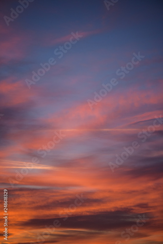  Sunset sky with clouds. Golden sunlight for your idea of web header. Cloudy landscape for background in serenity colors - blue, violet, yellow and pink tone.