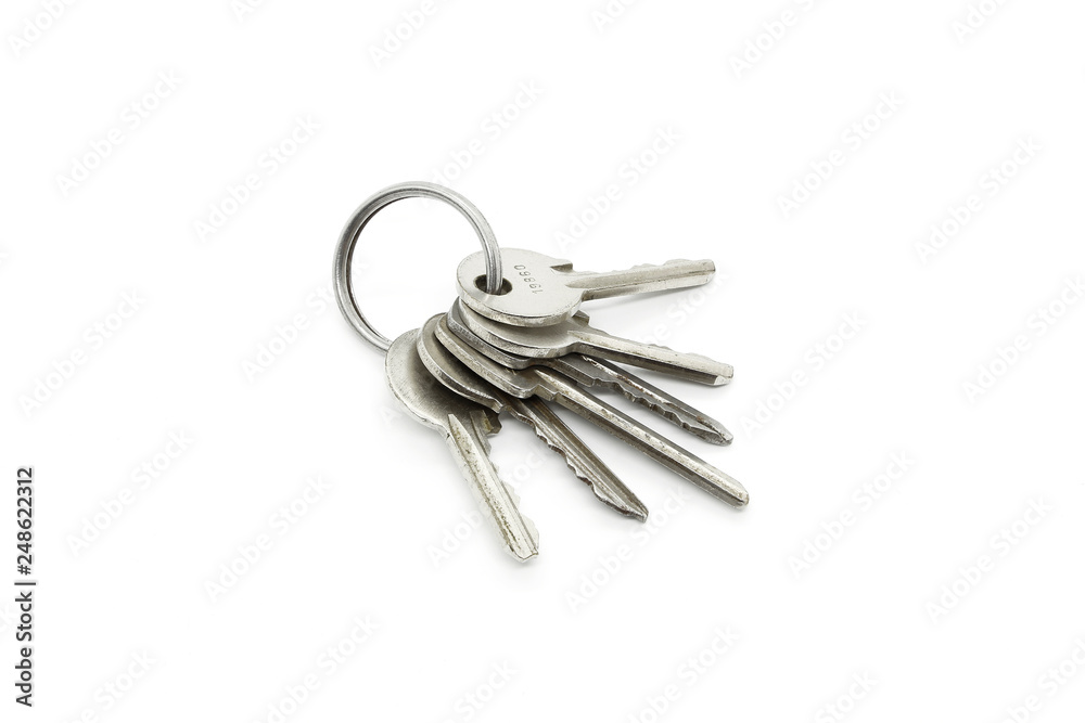 Silver keys on the ring on white background Silver keys on the ring on white background