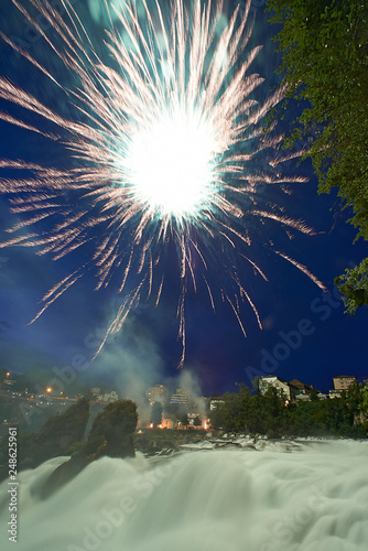 Amazing fireworks display high up in the Swiss mountains celebration Swiss national day in Schaffhausen the place where the river Rheine has its origin photo