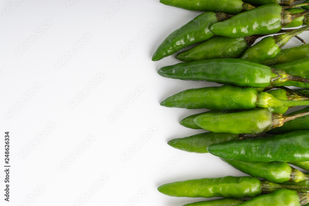 Green Bird's eye chili ,Thai Chili pepper ,bird chili pepper nature isolate on white background. Selective focus and crop fragment