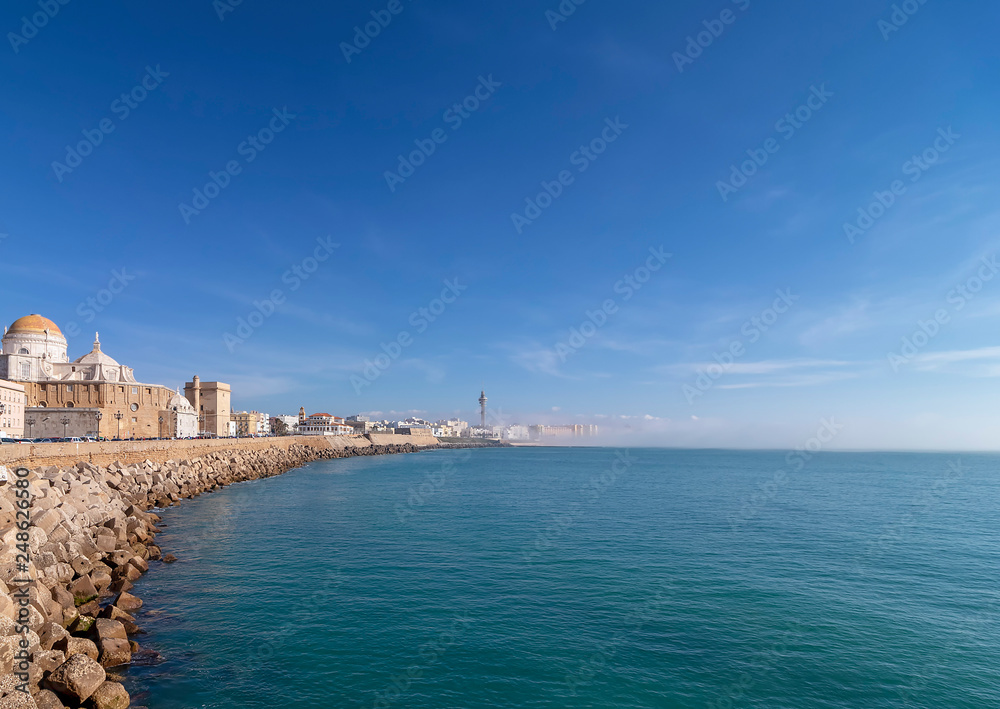 Seaside view in Cadiz Andalusia Spain. Central city seafront. Fog above the waters.