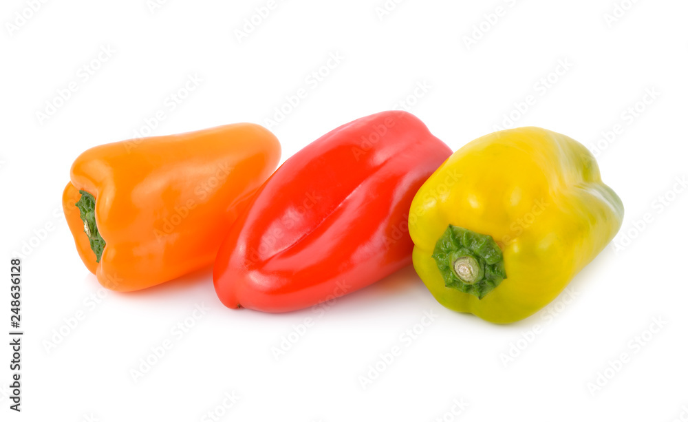 fresh Aura sweet red, orange and yellow-green peppers on white background fresh Aura sweet red, orange and yellow-green peppers on white background