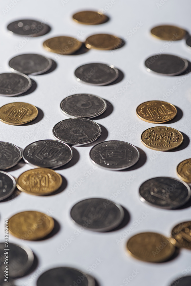 selective focus of ukrainian coins on grey blurred background selective focus of ukrainian coins on grey blurred background