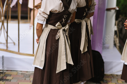 Two girls servants dressed in vintage dress waiting