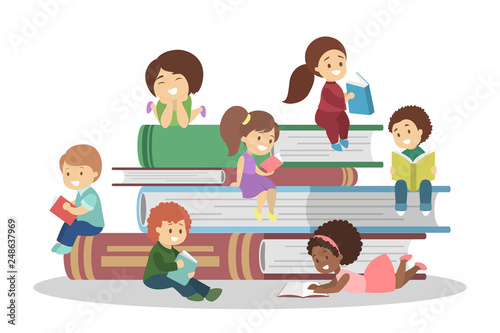 Little children sitting on a book stack and reading