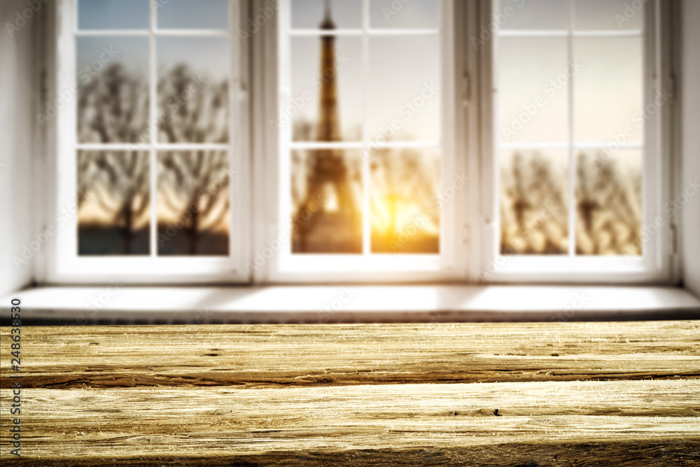 Table background of free space for your decoration. White wooden window space. Sunset time and Paris city landscape. Table background of free space for your decoration. White wooden window space. Sunset time and Paris city landscape.