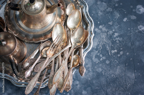 Fotografie Melkhiorovye vintage dining items (tray, kettle, forks, knives, spoons,) top vie