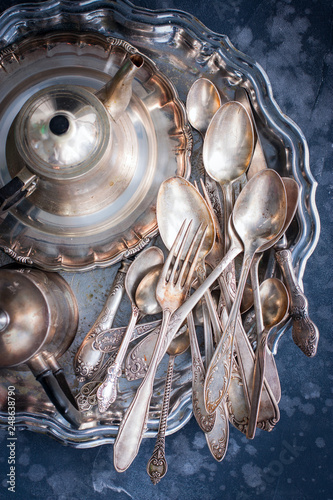 Obraz na płótnie Melchior vintage dining items (tray, kettle, forks, knives, spoons, top view