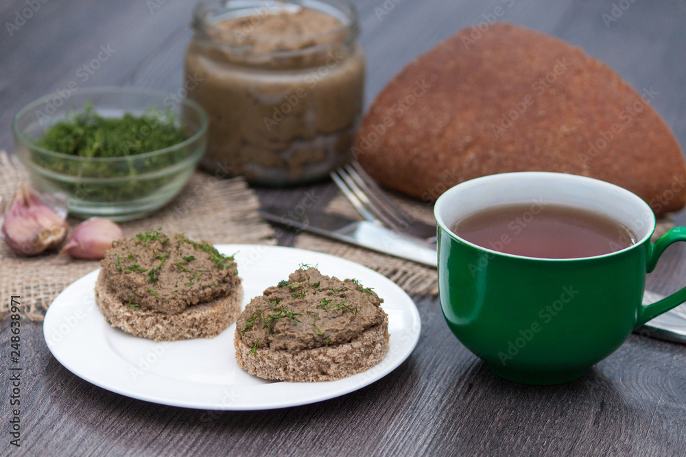 Fresh homemade chicken, pork, beef liver pate or paste on bread on rustic background Fresh homemade chicken, pork, beef liver pate or paste on bread on rustic background