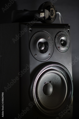 Audio speaker and headphones on top