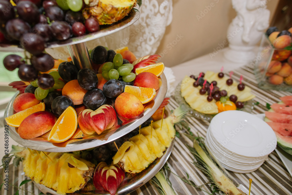 Wedding buffet table with different variety of fresh fruits Wedding buffet table with different variety of fresh fruits
