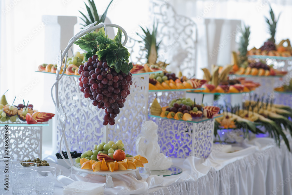 Wedding buffet table with different variety of fresh fruits