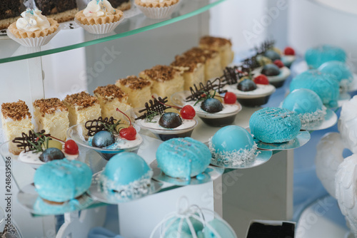 Variety of candies, cakes and cupcakes at the candy bar