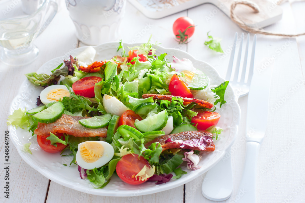 Horizontal shot of large white bowl of Deviled Egg Salad on dark wooden background Horizontal shot of large white bowl of Deviled Egg Salad on dark wooden background