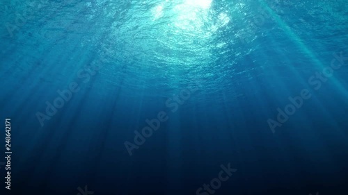 Deep Underwater with Sun Rays photo