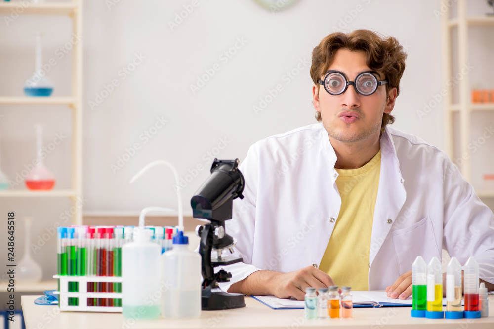 Funny crazy chemist doing experiments and tests Funny crazy chemist doing experiments and tests