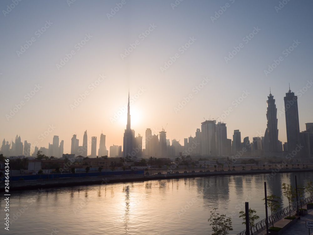 Panorama of the city of Dubai early in the morning at sunrise with a bridge over the city channel Dubai Greek.