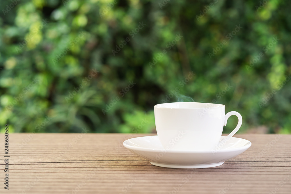 White ceramic coffee cup on table White ceramic coffee cup on table