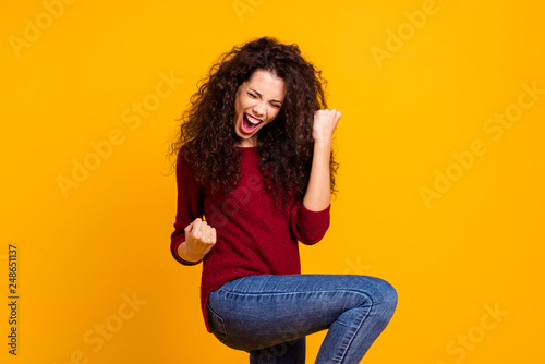 Close up photo amazing beautiful her she lady all possible yell voice raised fists hip in delight like rock star guitar wear red knitted sweater pullover clothes outfit isolated yellow background