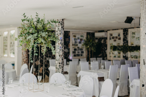 Wedding table decorated with bouquet and candles