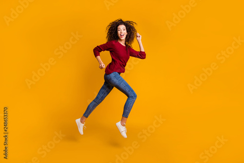 Full length body size view of her she nice pretty attractive cheerful cheery sportive slim thin fit wavy-haired lady running rush hour isolated on bright vivid shine orange background