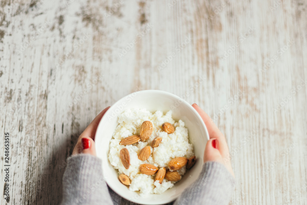 Fototapeta premium cottage cheese with almonds and honey