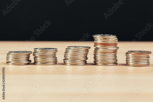 piles of coins on working table