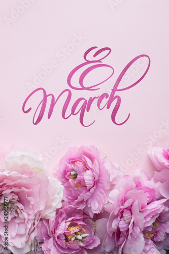 8 march hand lettering and peonies flowers. Woman's Day greeting card background.