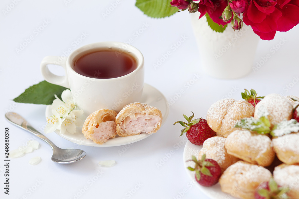 Home made cake eclairs. Traditional eclairs, profitroles classic, eclairs french. Background to Valentine's day, festive tea party. Food concept. Home made cake eclairs. Traditional eclairs, profitroles classic, eclairs french. Background to Valentine's day, festive tea party. Food concept.