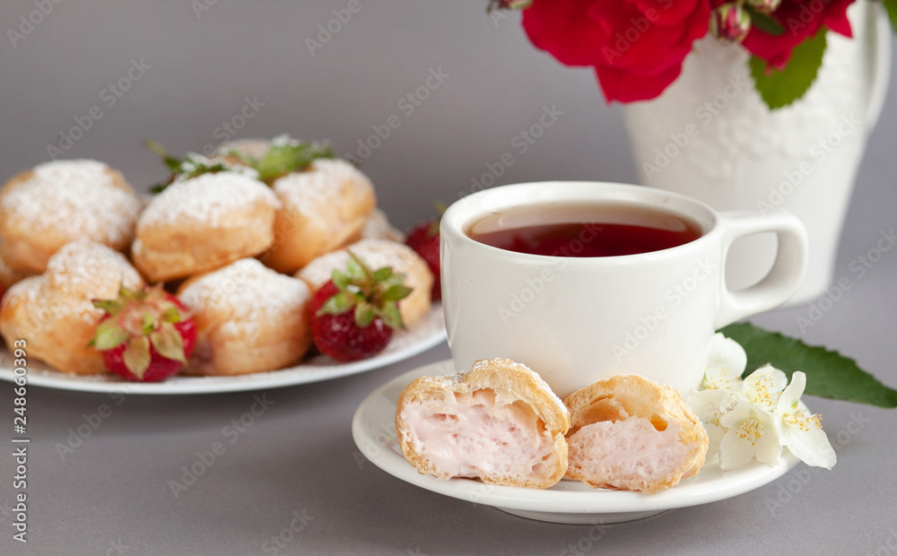 Food concept. Home made cake eclairs. Traditional eclairs, profitroles classic, eclairs french. Background to Valentine's day, festive tea party.