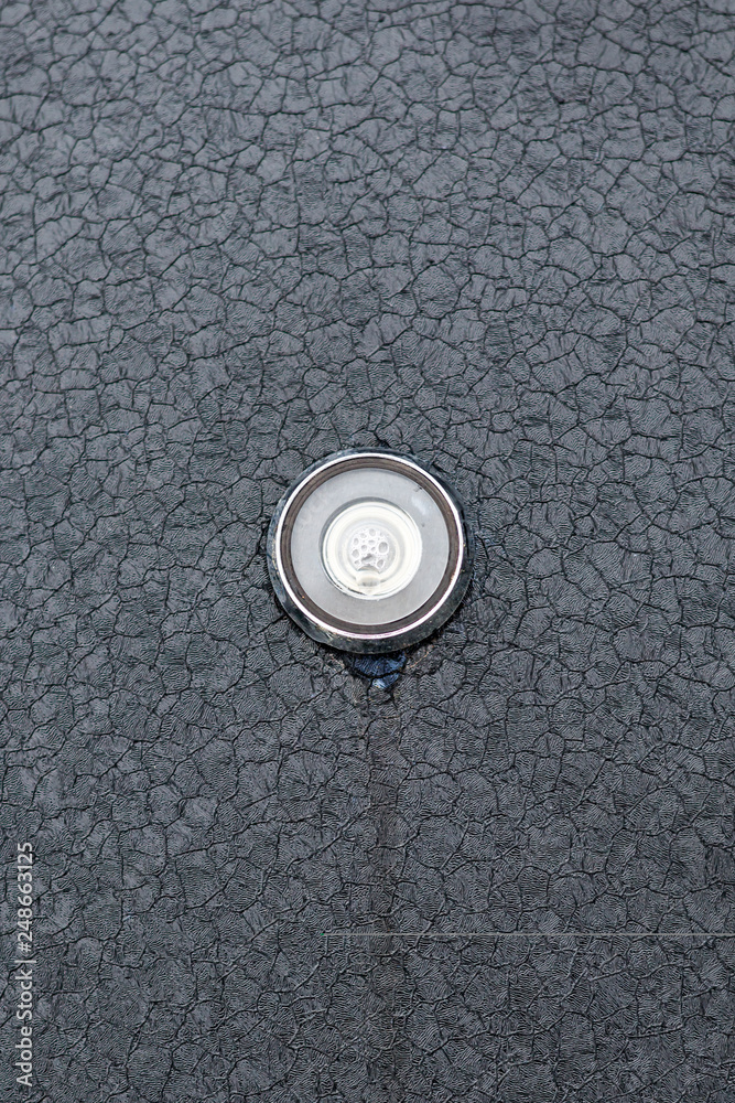 steel door. view from the street. peephole from the temperature drop is all in the bubbles. steel door. view from the street. peephole from the temperature drop is all in the bubbles.