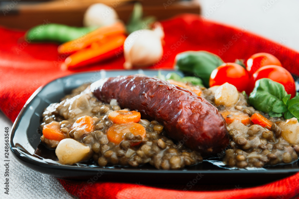 Homemade Sausage Cooked lentils with baby onions and carrots
