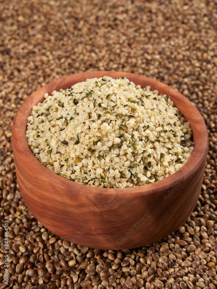 Bowl of shelled hemp seeds. Dietary supplement rich in protein and fibre. Bowl of shelled hemp seeds. Dietary supplement rich in protein and fibre.