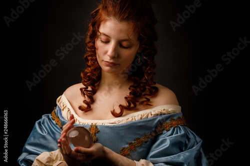 Baroque woman with glass ball
