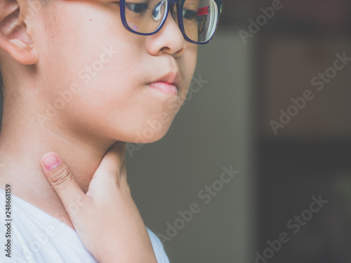 Little ill boy get sore throat with unhappy. Allergy concept