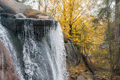 Waterfall cascading over rocks in Sapokka landscaping park Kotka, Finland photo