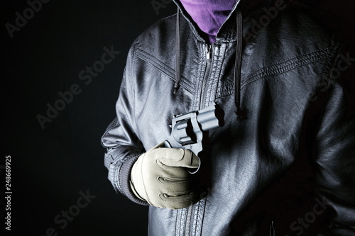 Photography Dangerous criminal hold gun in hand