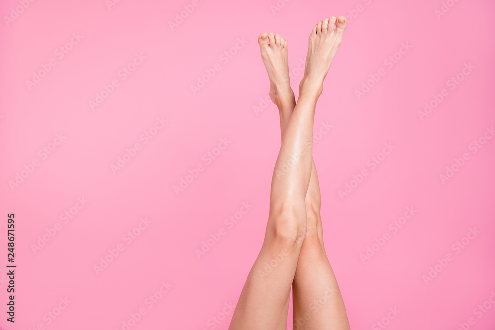 Cropped close-up image view photo of nice perfect long attractive feminine fit thin slim soft smooth shine shaven legs ad advert isolated over pink pastel background - obrazy, fototapety, plakaty 
