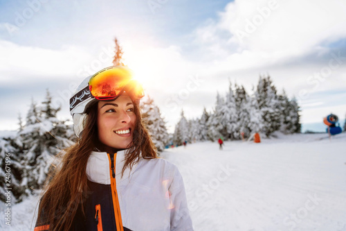 Close up Happy girl enjoying winter moments helmet on his head