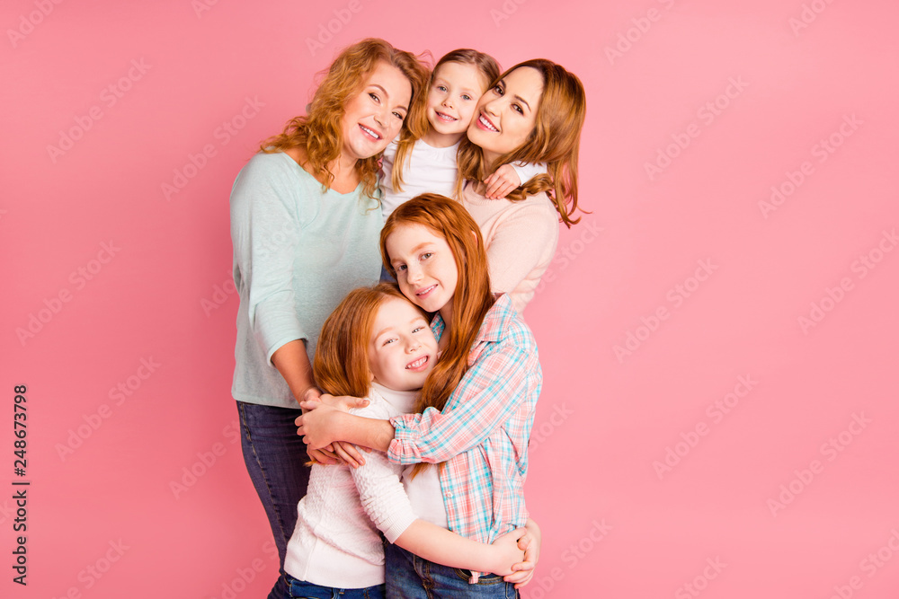 Close up family girlish gift photo set foxy little girls mom granny stand close tight toothy smile glad weekend spend free time wear sweaters shirts pullovers isolated on rose background